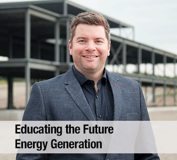 A man in a suit looks straight ahead - Educating the future energy generation