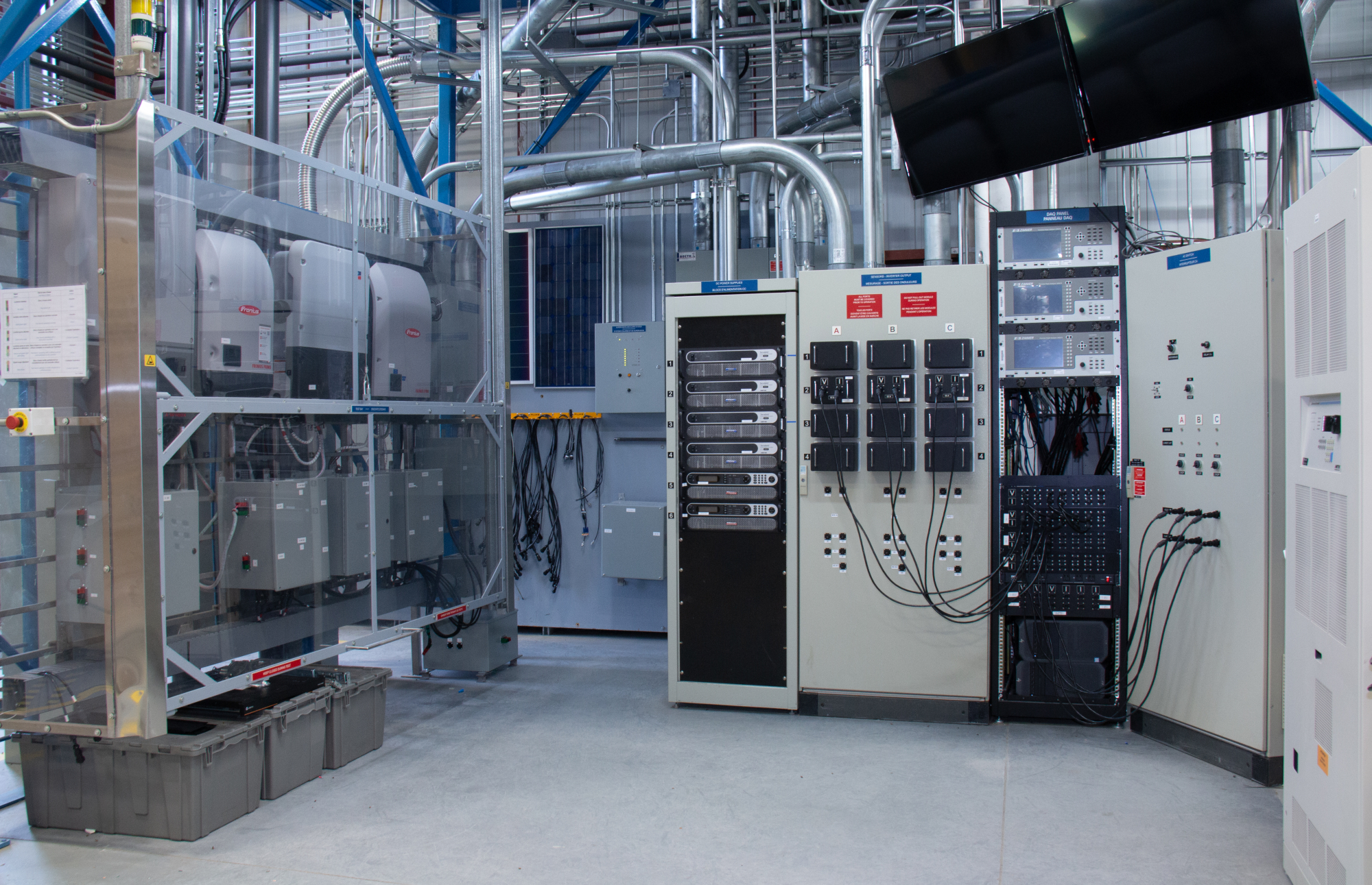  The image shows a view of the inverter and grid emulating test bench at CanmetENERGY in Varennes.