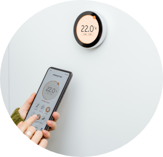 Image of programmable thermostats with remote showing 22 on the screen
