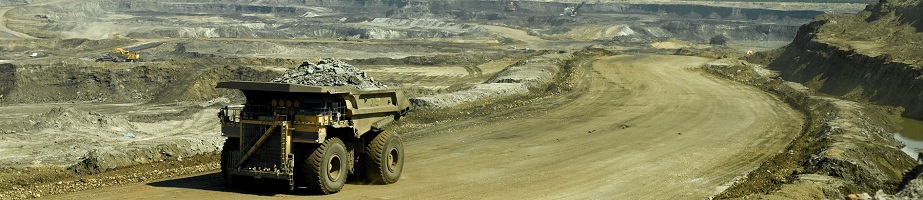 A large industrial dump truck in the oil sand region of Canada