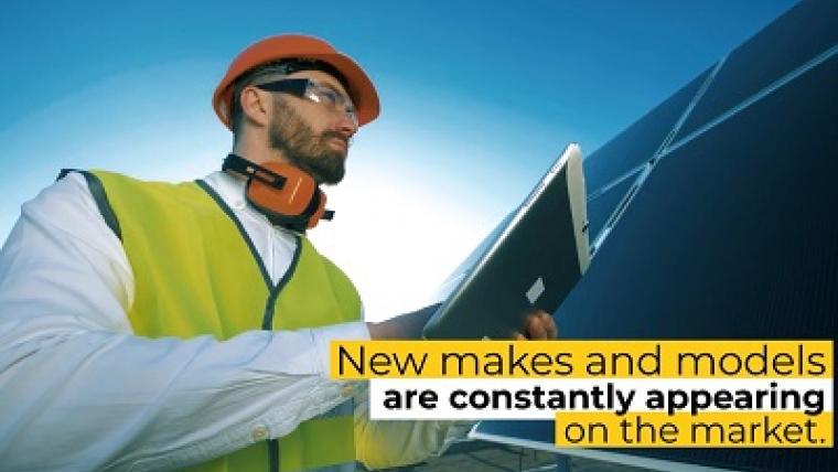 Man in safety gear evaluates a large solar panel. On screen text: New makes and models are constantly appearing on the market.
