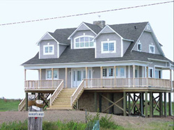 FIGURE 18: Construction of buildings on pylons as an example of adaptation that reduces vulnerability to storm surges, Grand-Barachois (near Shediac), Northumberland Strait, southeastern New Brunswick. Photo courtesy of Armand Robichaud.